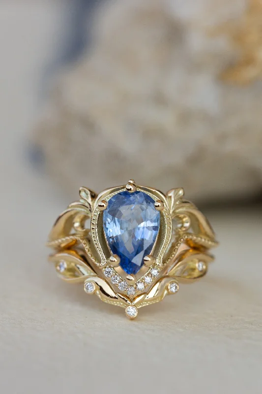 Icy blue sapphire engagement ring with a stacking wedding band / Lida